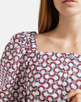 Printed cotton blouse with mother-of-pearl button closure and voluminous 2/4 length sleeves .