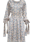 Knee-length floral print dress with a round neckline and long sleeves with button cuffs and removable ribbons.